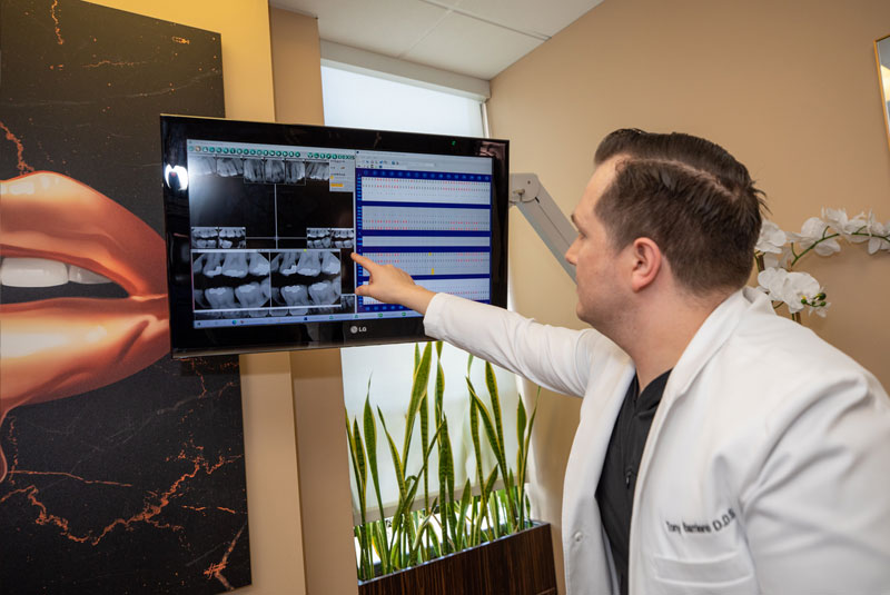 Dr. Barriere reviewing a scan on screen